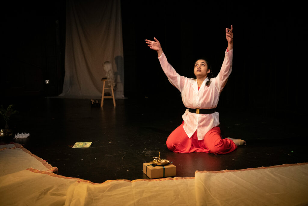 Naked Stages Performer on knees reaching up